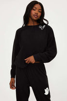 Shop Beach Riot Beach Riot Devyn Boo Black Sweatshirt Sweater for women – premium loungewear and festival fashion at Spoiled Brat