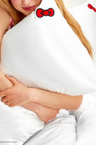 Shop Kitsch Hello Kitty x Kitsch Satin Pillowcase - Solid Ivory Hello Kitty Bow Pillow for women – premium loungewear and festival fashion at Spoiled Brat