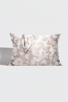 Camouflage-patterned pillow on a white background