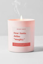 Pink candle with a label on a pink background