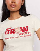 Shop Samii Ryan Samii Ryan x Smileyworld® Just Grow With It Baby Tee T-Shirt for women – premium loungewear and festival fashion at Spoiled Brat