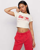 Shop Samii Ryan Samii Ryan x Smileyworld® Just Grow With It Baby Tee T-Shirt for women – premium loungewear and festival fashion at Spoiled Brat