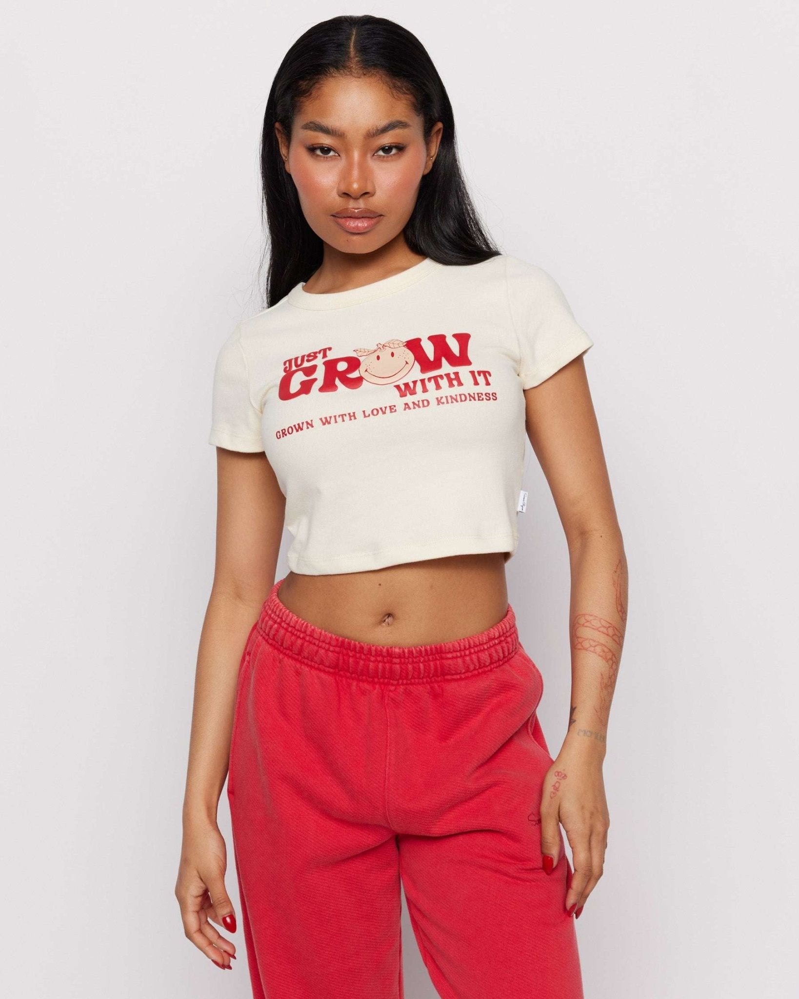 Shop Samii Ryan Samii Ryan x Smileyworld® Just Grow With It Baby Tee T-Shirt for women – premium loungewear and festival fashion at Spoiled Brat