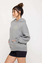 Shop Spiritual Gangster Spiritual Gangster SG Smiley Easy Hoodie Hooded Sweatshirt for women – premium loungewear and festival fashion at Spoiled Brat