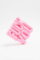 Pink textured CANDLE on a white background
