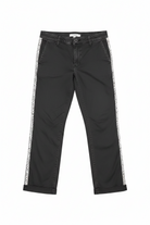 Black pants with white lace trim on a white background